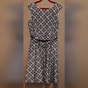 Black&white dress with abstract flower pattern and thin bow belt .  Size 18.